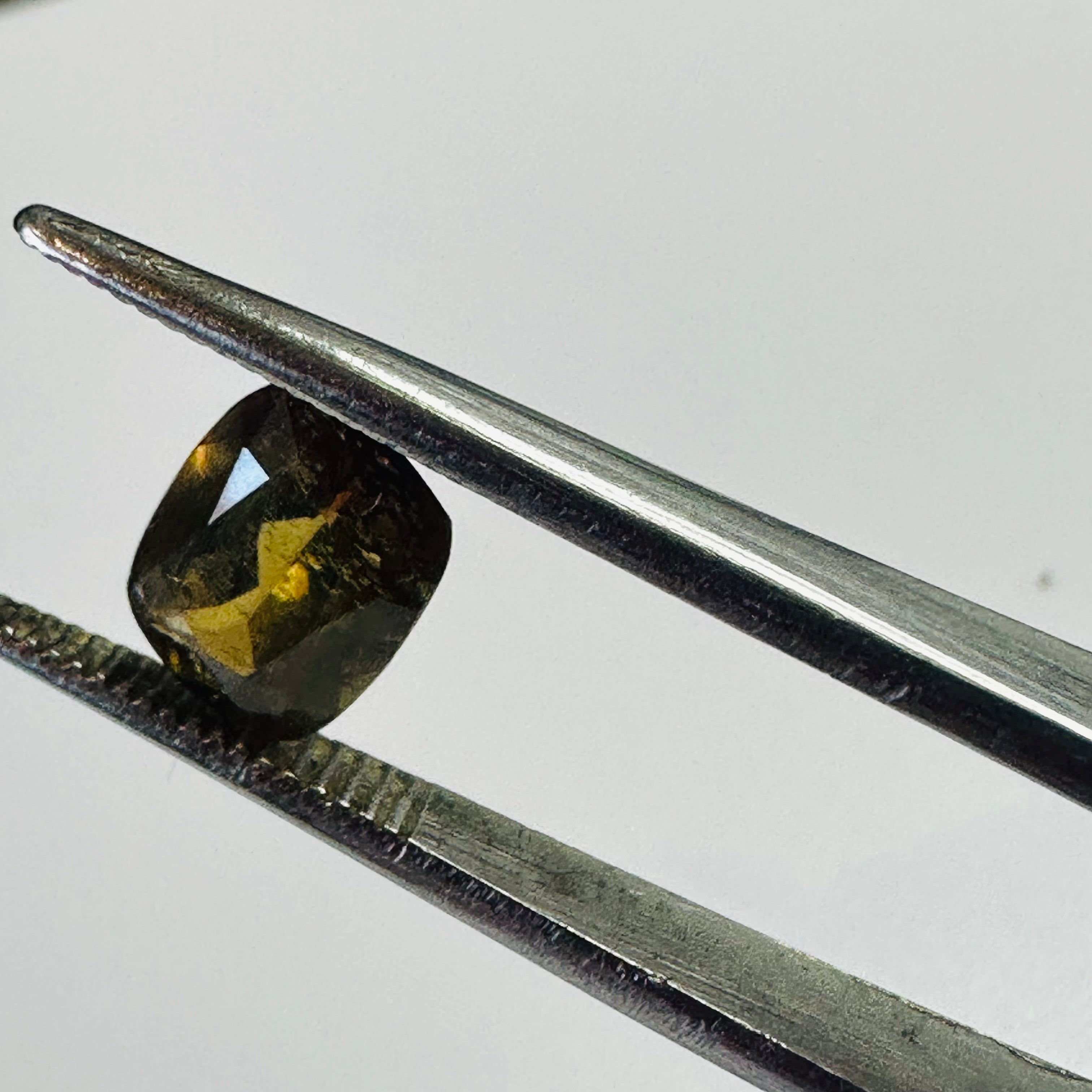 ANDALUSITE  TRAP CUT 8.5MMX6.5MM.  1.47CTS GREEN TO RED image 4