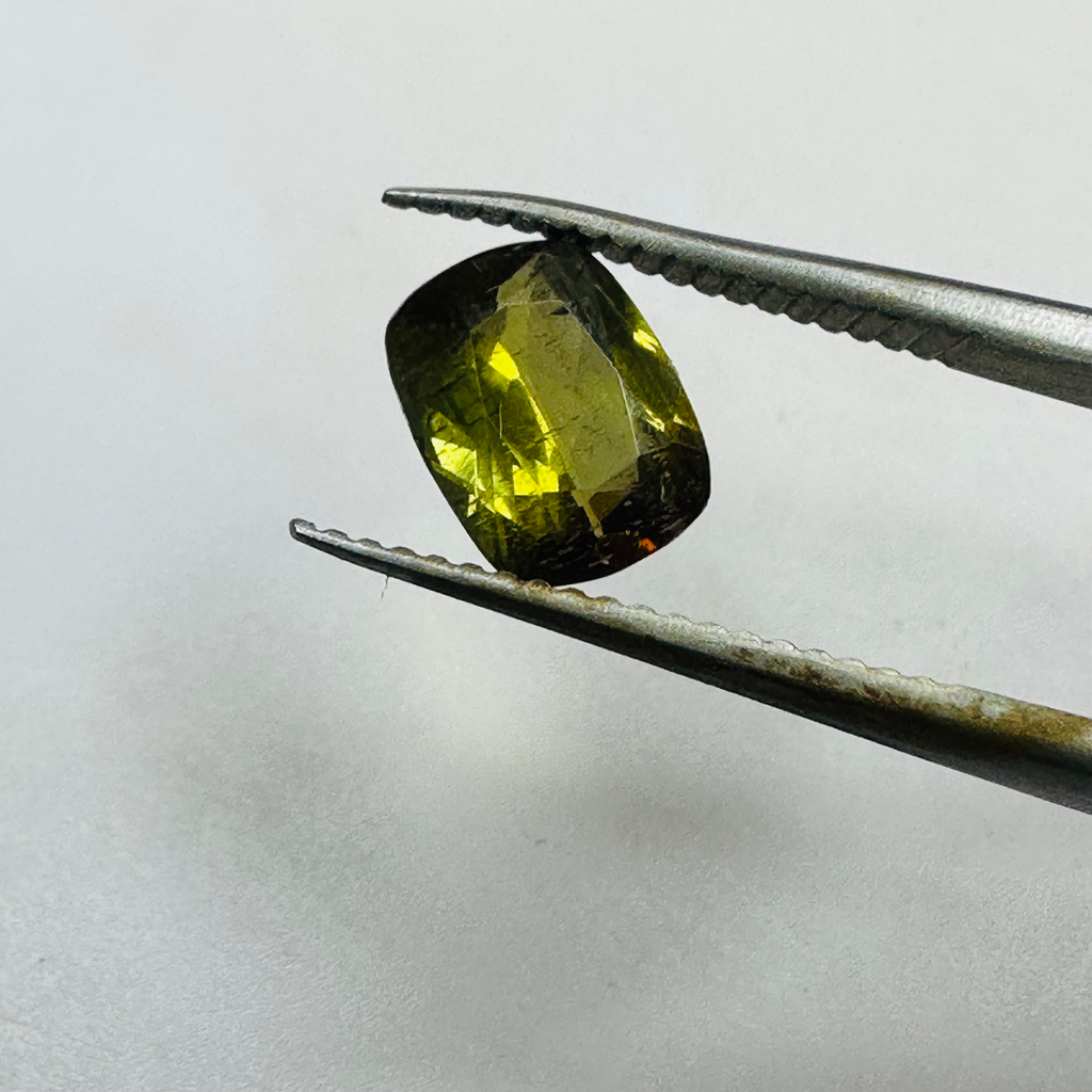 ANDALUSITE  TRAP CUT 8.5MMX6.5MM.  1.47CTS GREEN TO RED image 1