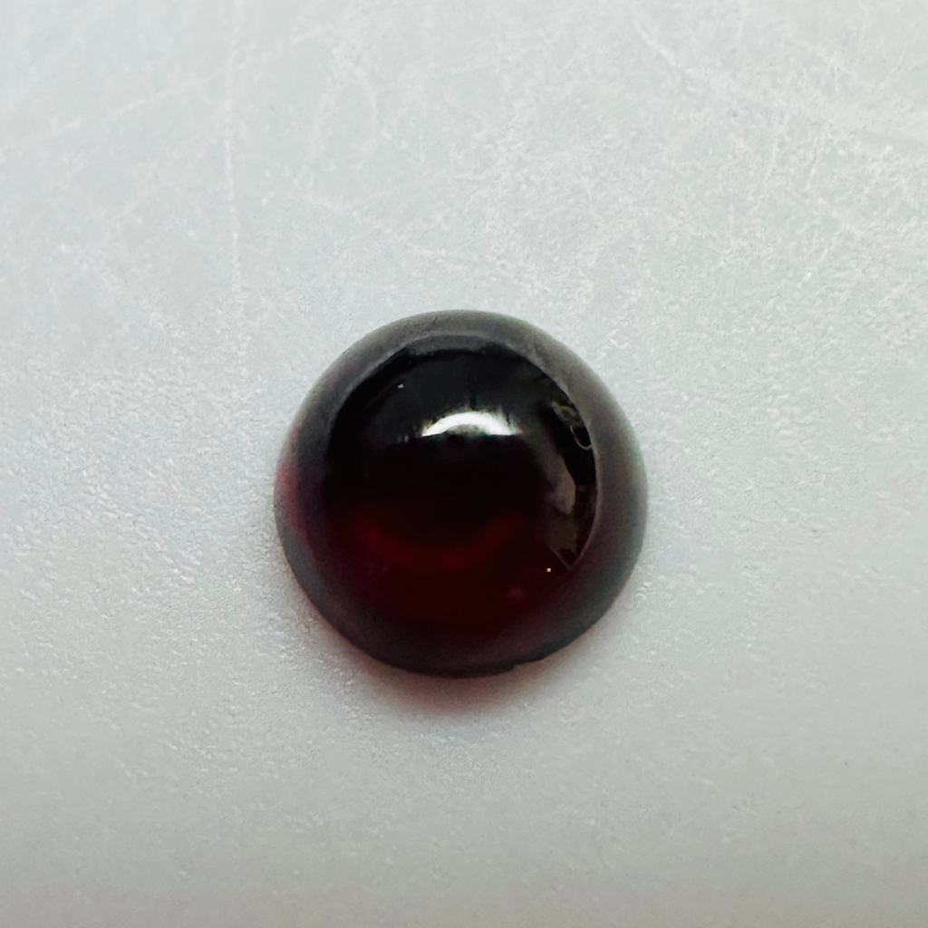 GARNET ROUND CAB 7MM.  1.96CTS image 4