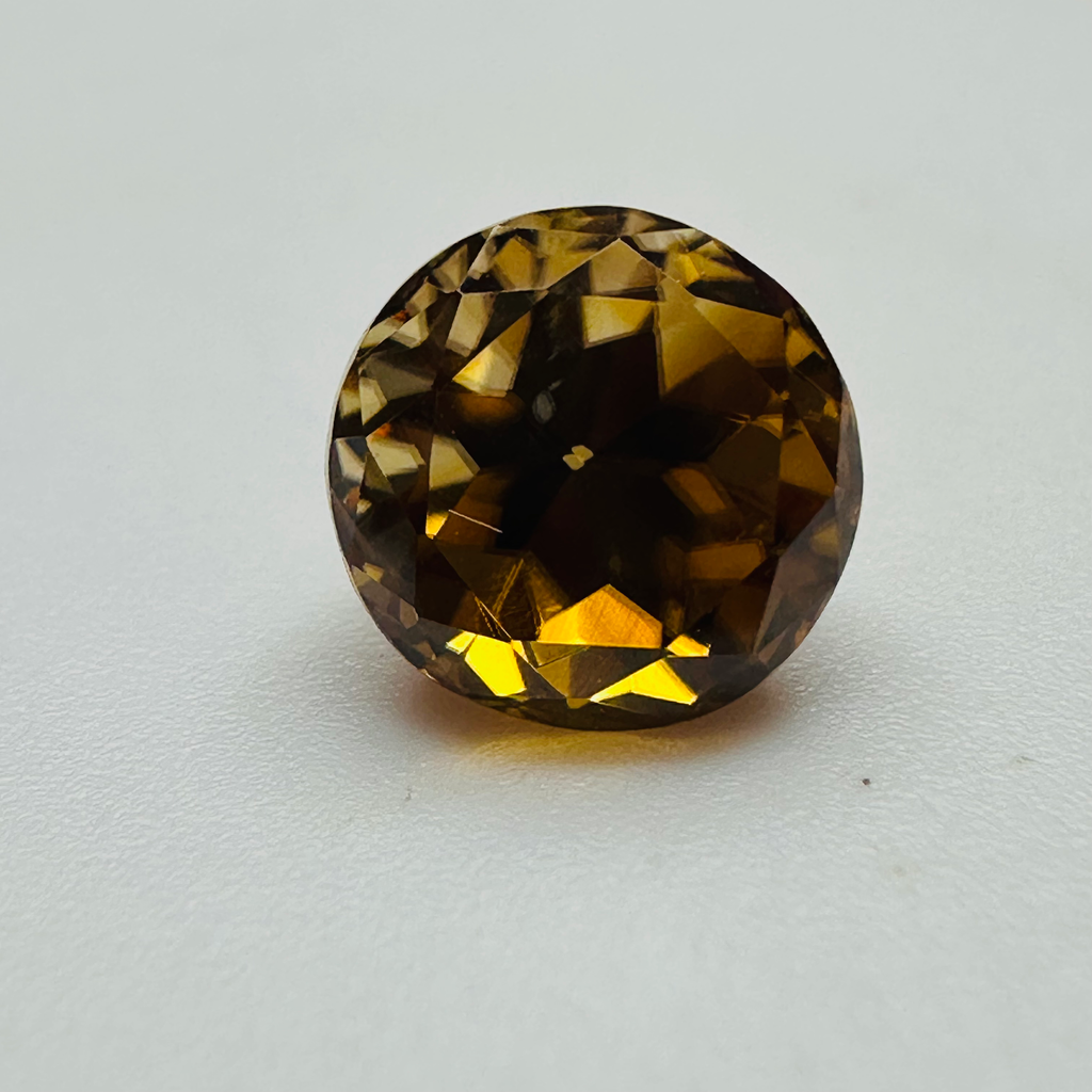 ZIRCON GOLDEN ROUND 7.7MM  3.23CTS image 1