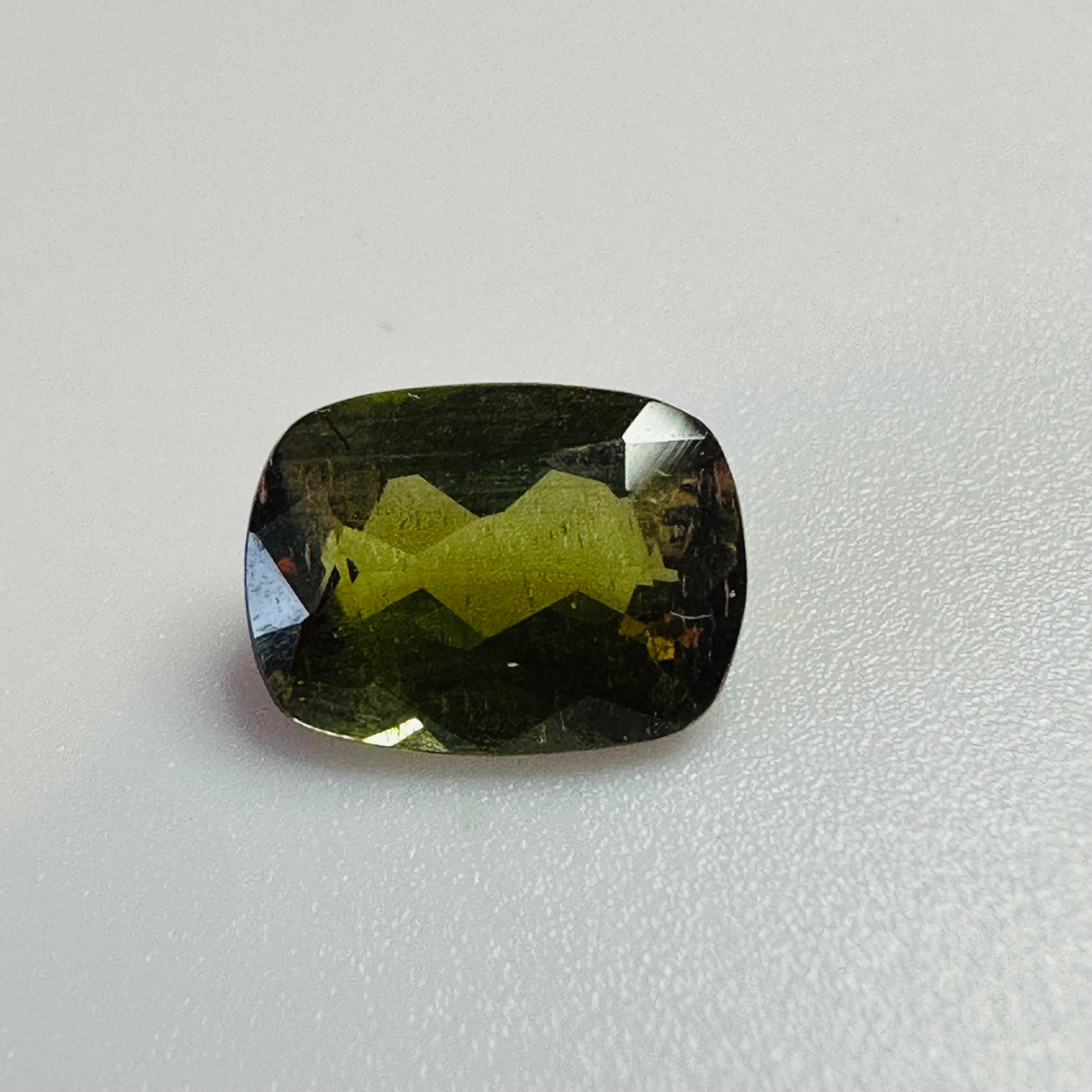 ANDALUSITE  TRAP CUT 8.5MMX6.5MM.  1.47CTS GREEN TO RED image 2