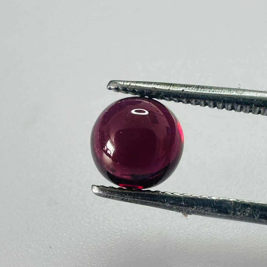 GARNET ROUND CAB 7MM.  1.96CTS image 1