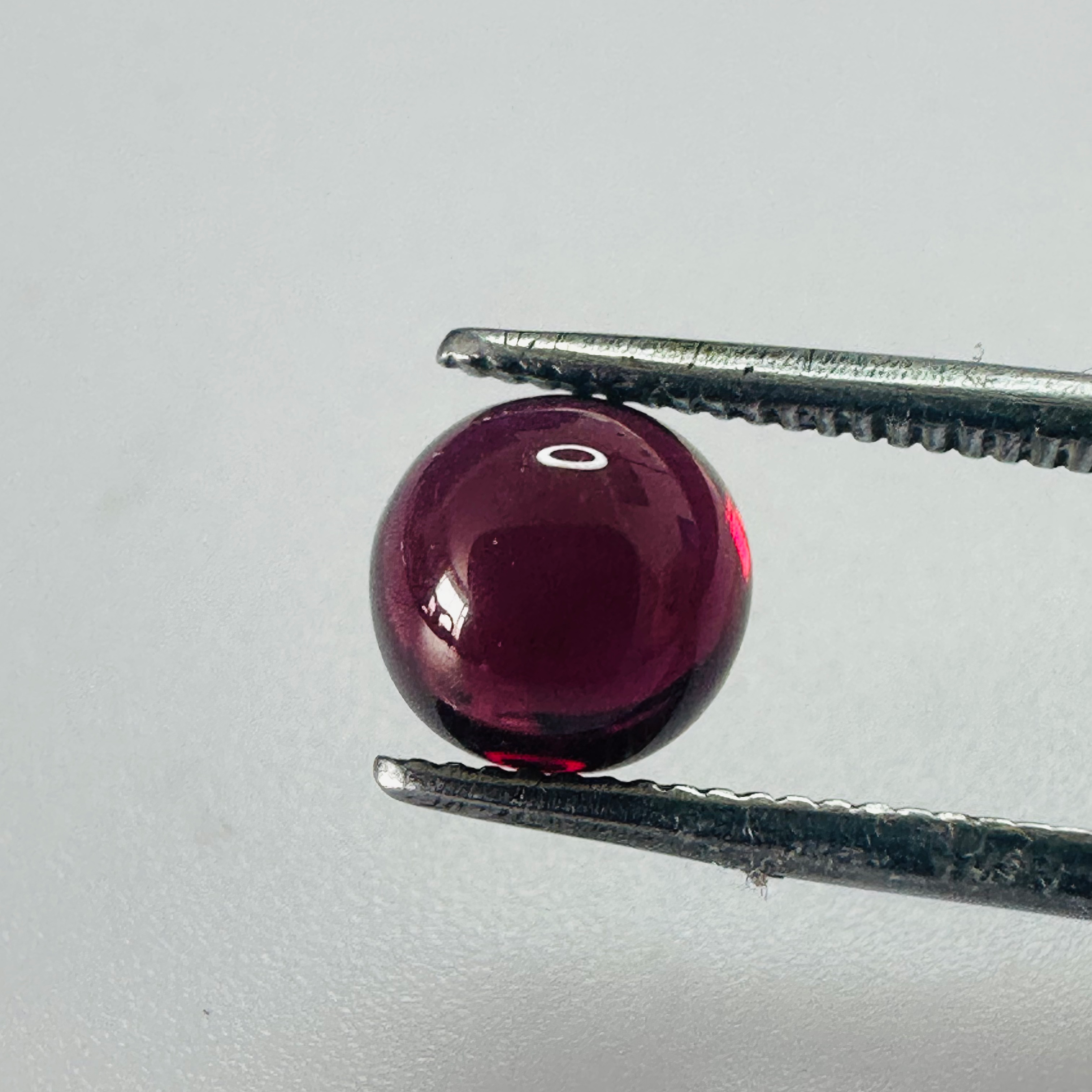 GARNET ROUND CAB 7MM.  1.96CTS image 1
