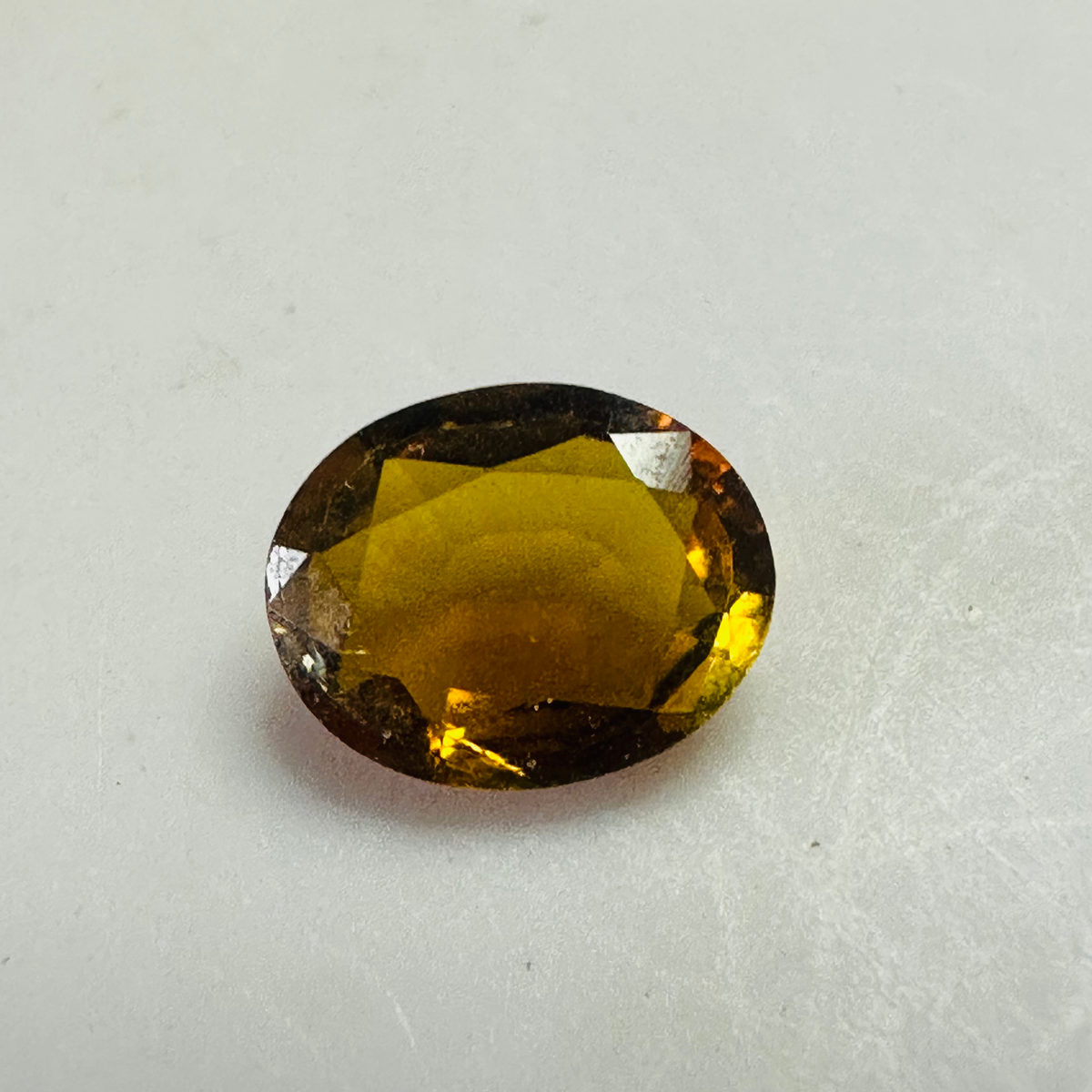 Tourmaline yellow/brown 7.4mmx6mm oval 1.03cts