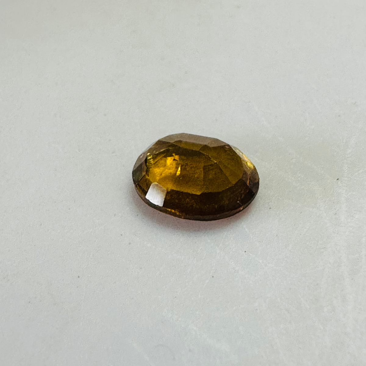 Tourmaline yellow/brown 7.4mmx6mm oval 1.03cts