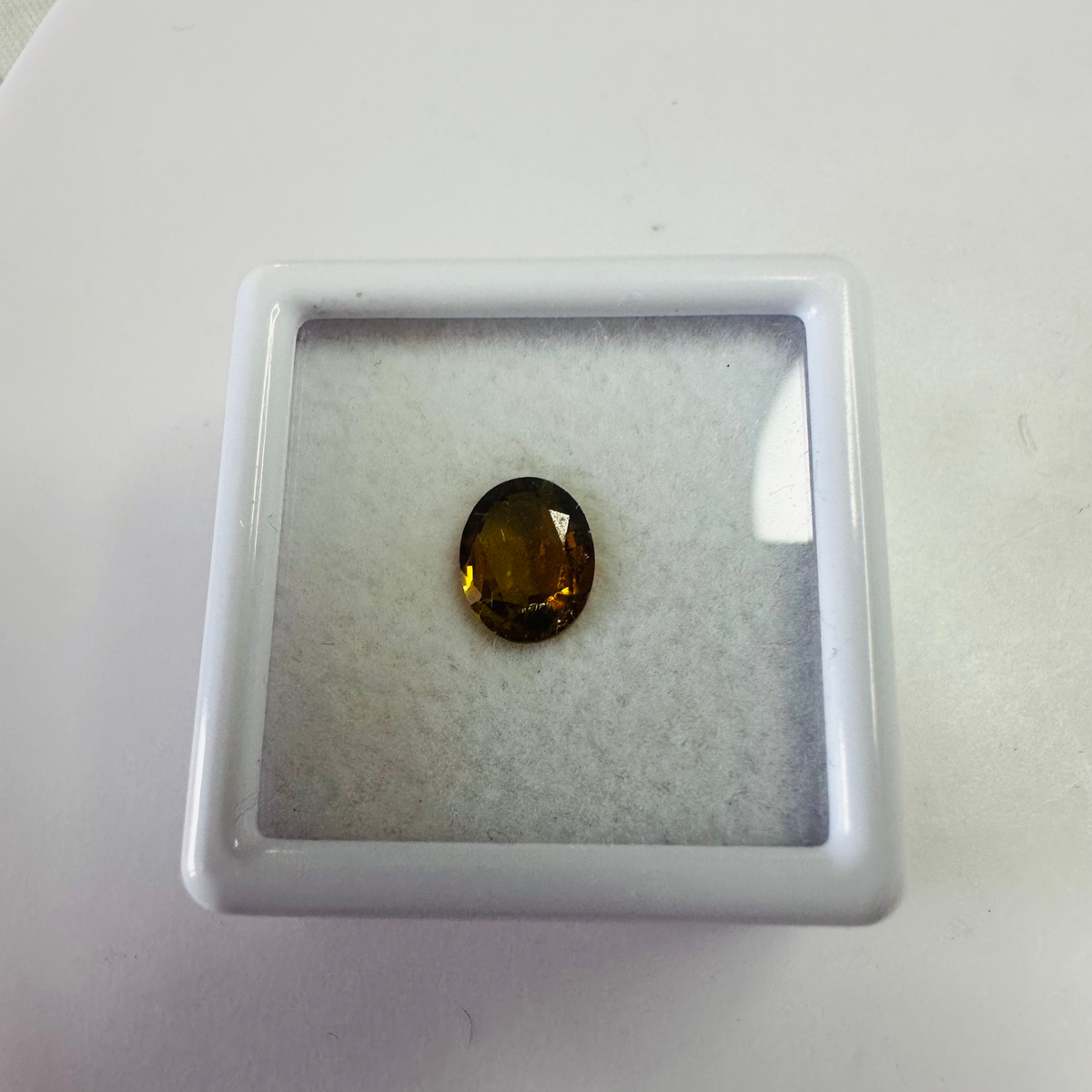 Tourmaline yellow/brown 7.4mmx6mm oval 1.03cts