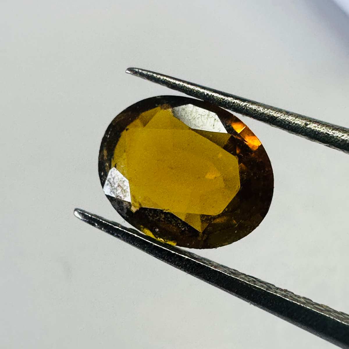 Tourmaline yellow/brown 7.4mmx6mm oval 1.03cts