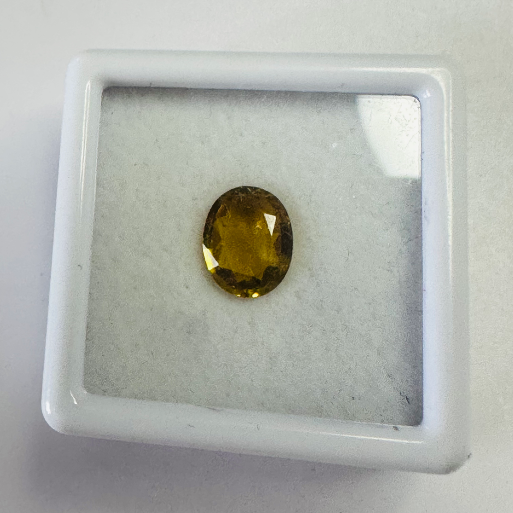Tourmaline dark yellow oval 8.2x6.5mm 1.21cts