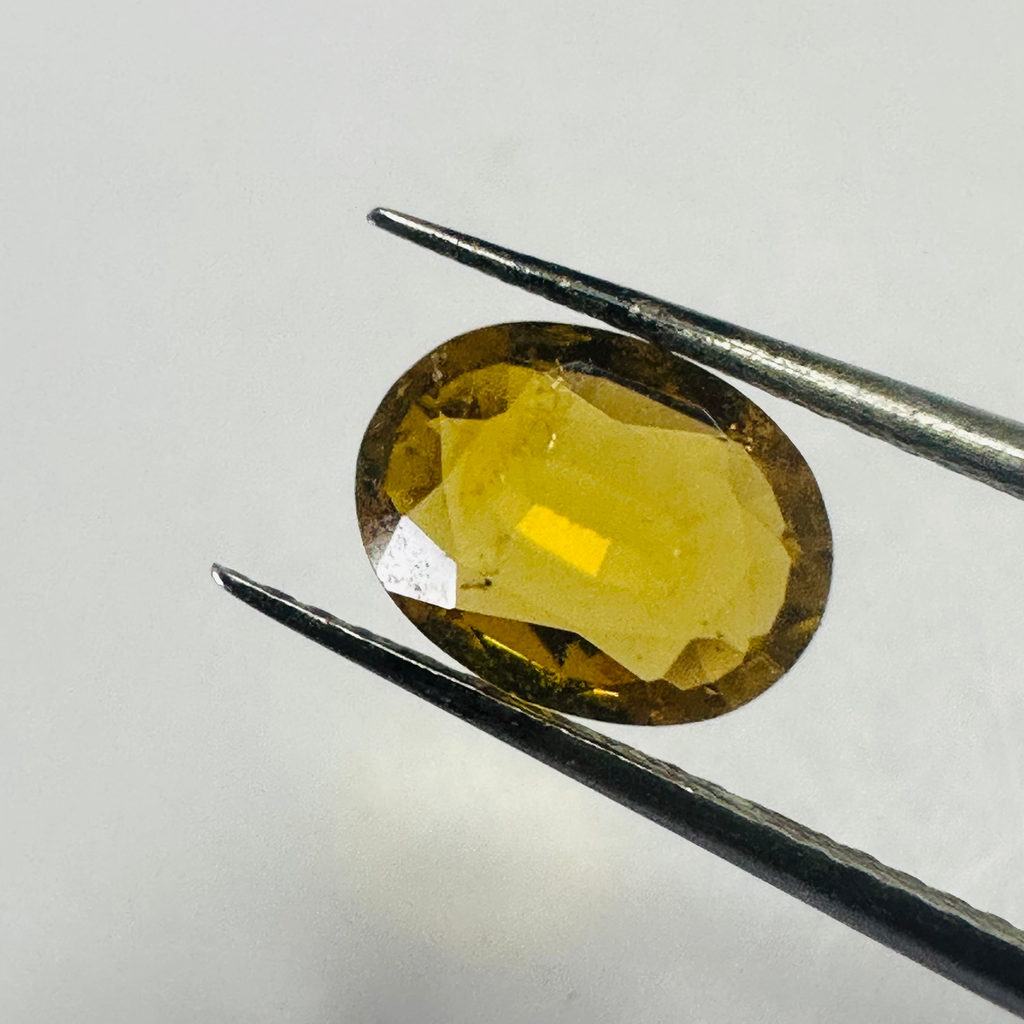 Tourmaline dark yellow oval 8.2x6.5mm 1.21cts