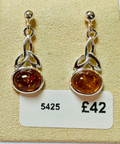 Sterling silver Amber Celtic knott earrings image 0