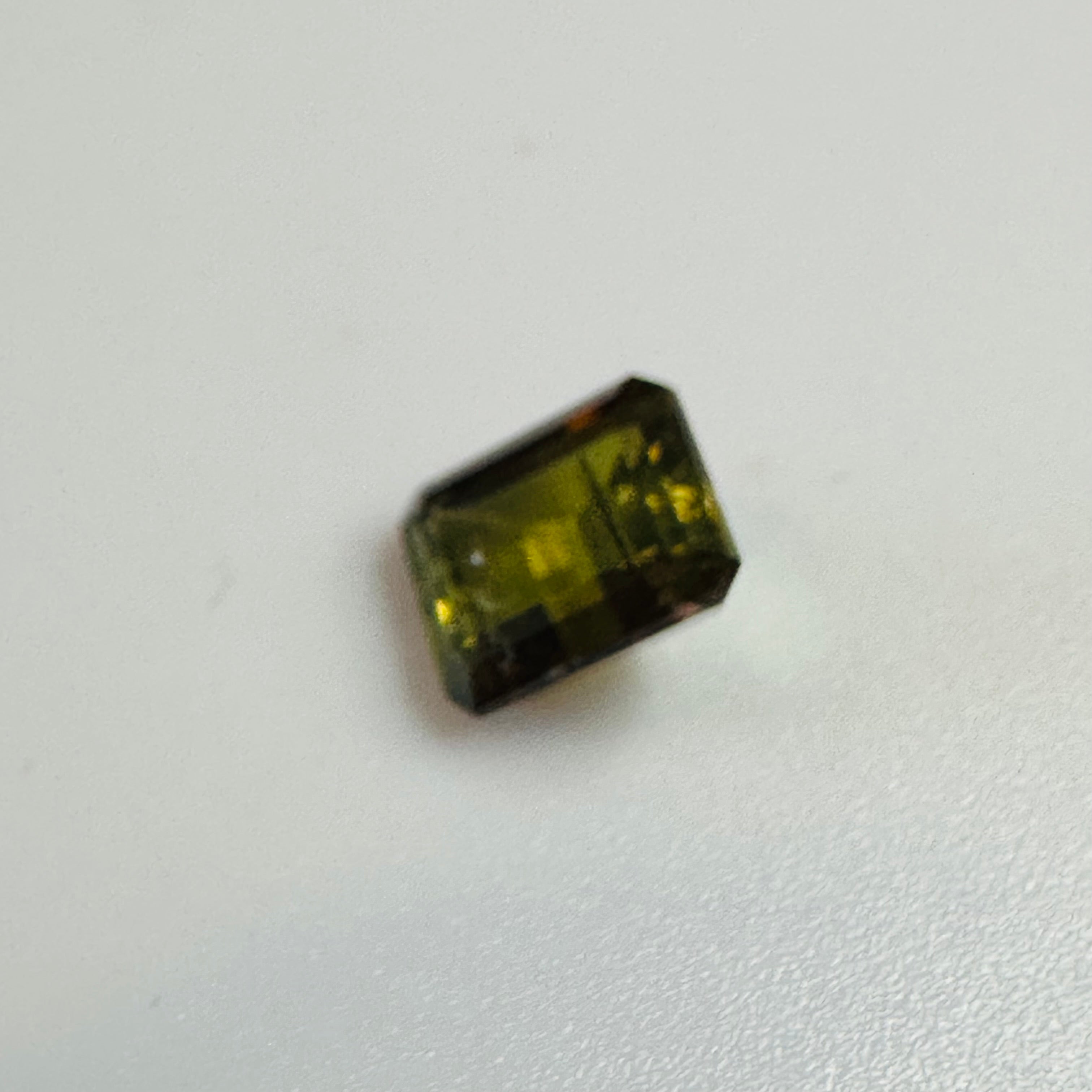 ANDALUSITE  TRAP CUT 7MMX5MM.  1.60CTS GREEN TO RED image 6