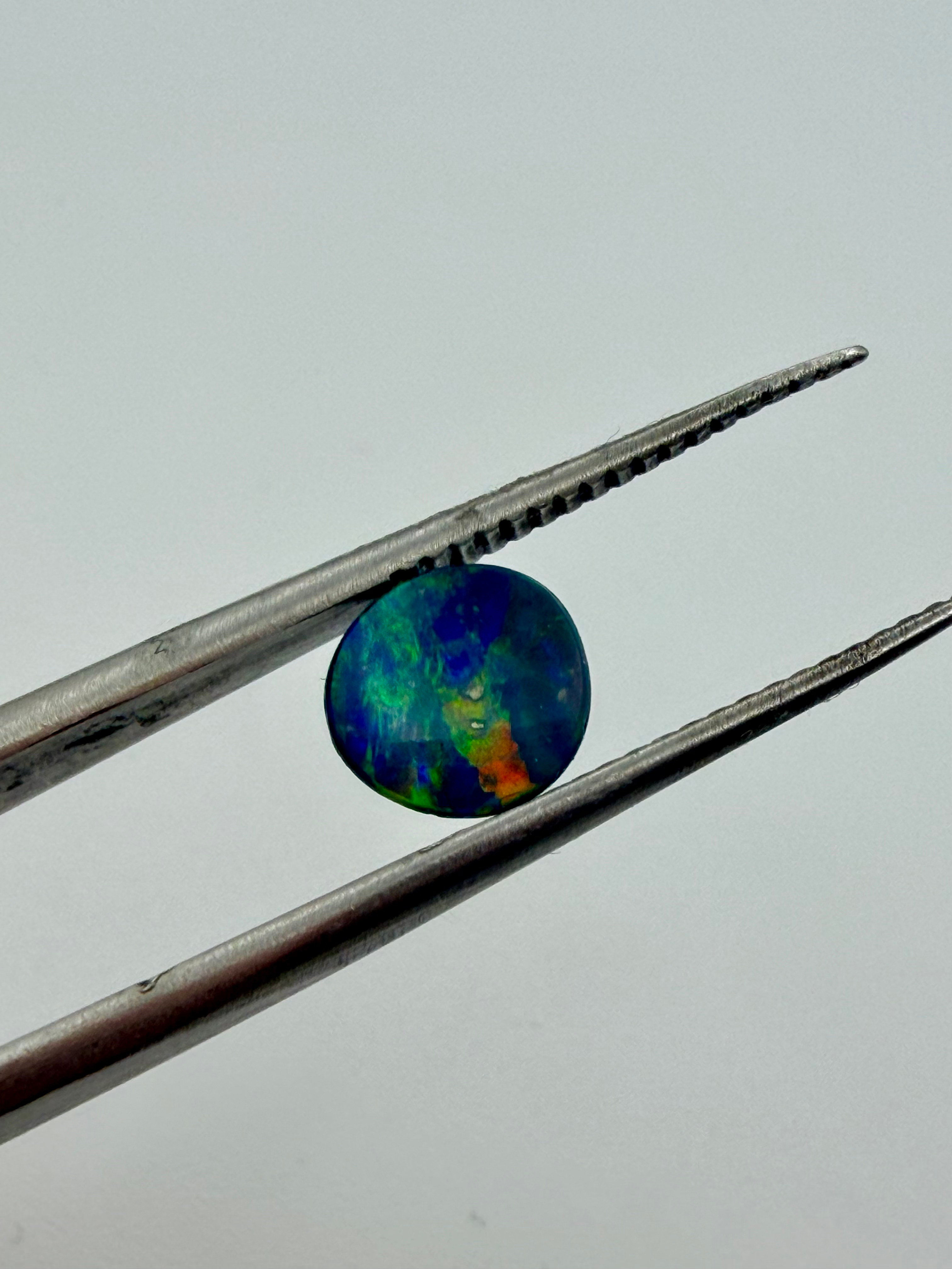 Opal Doublet Striking colours 7.2mm round 0.78cts image 2