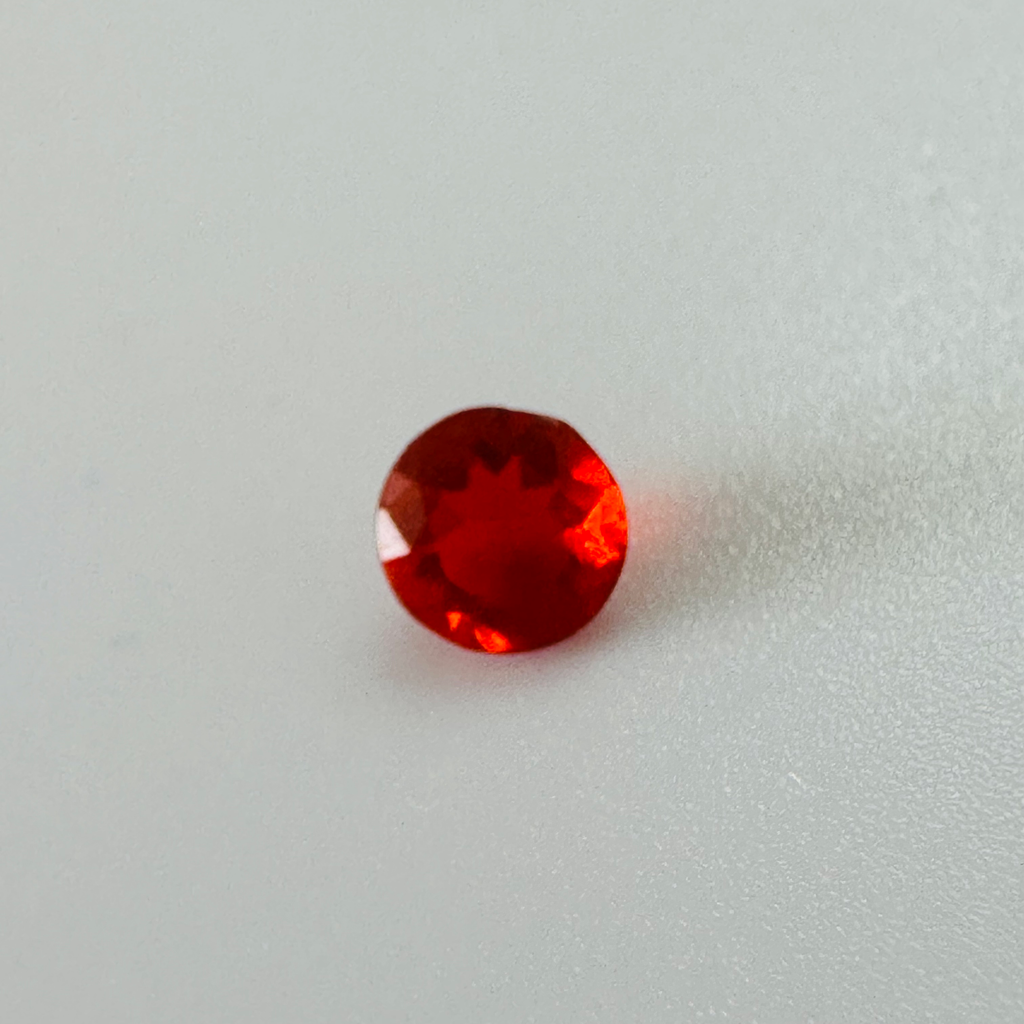 CHERRY RED FIRE OPAL ROUND 4.9MM ROUND  0.25CTS image 1