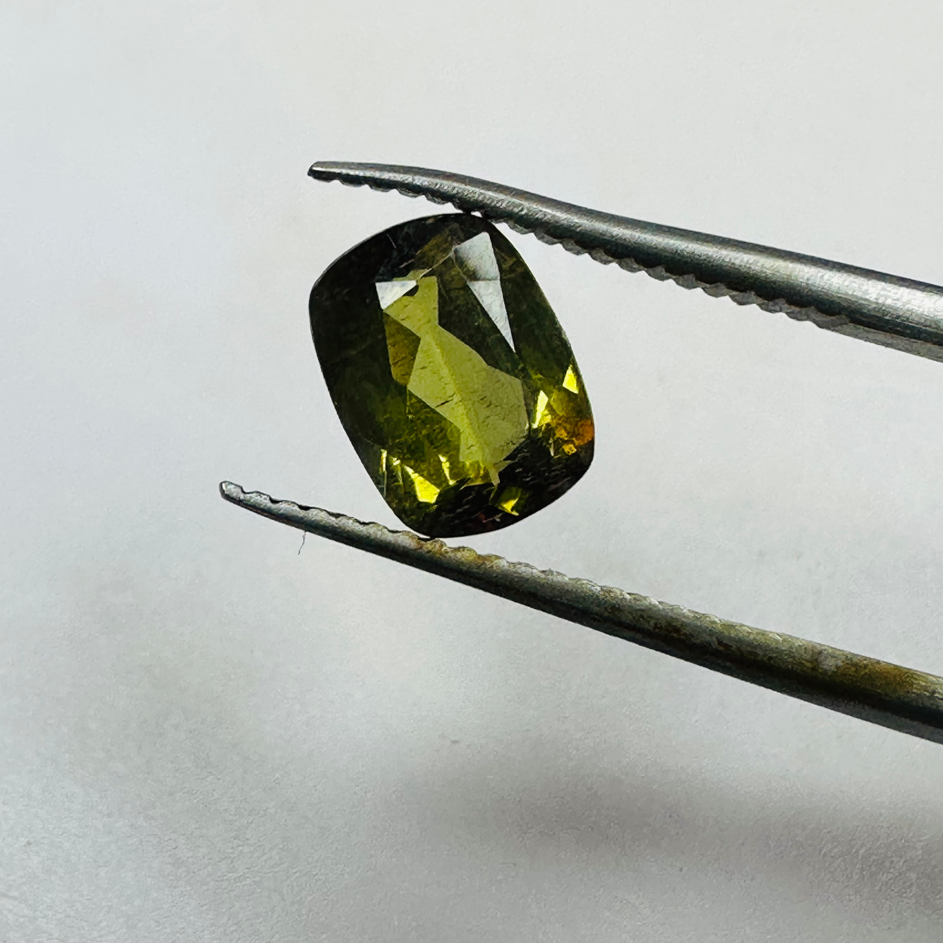 ANDALUSITE  TRAP CUT 8.5MMX6.5MM.  1.47CTS GREEN TO RED image 8