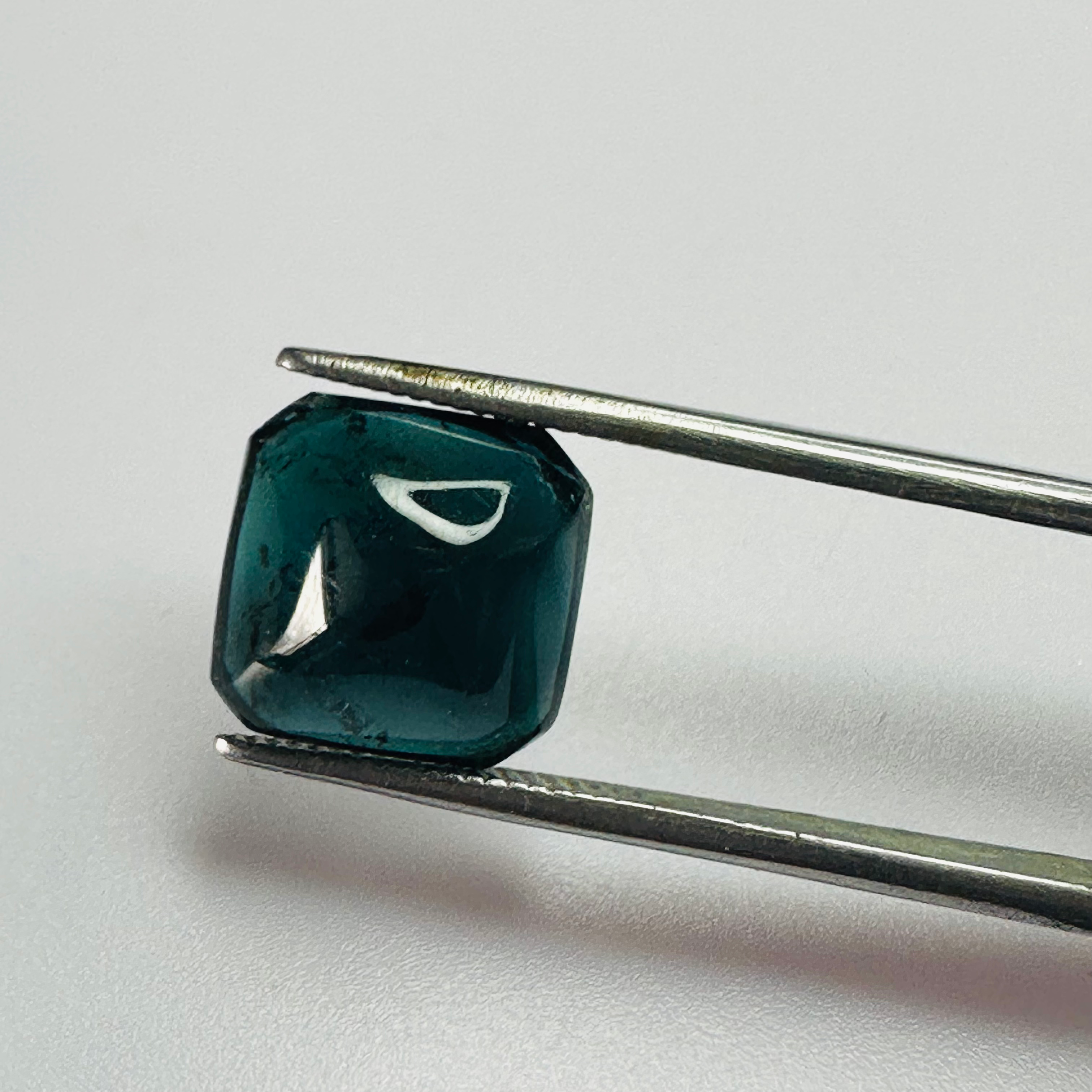 TOURMALINE BLUE 10.7MMX10.7MM  4.81CTS CARBUNCKLED image 0
