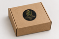 Cardboard box with round Salamandergems logo sticker