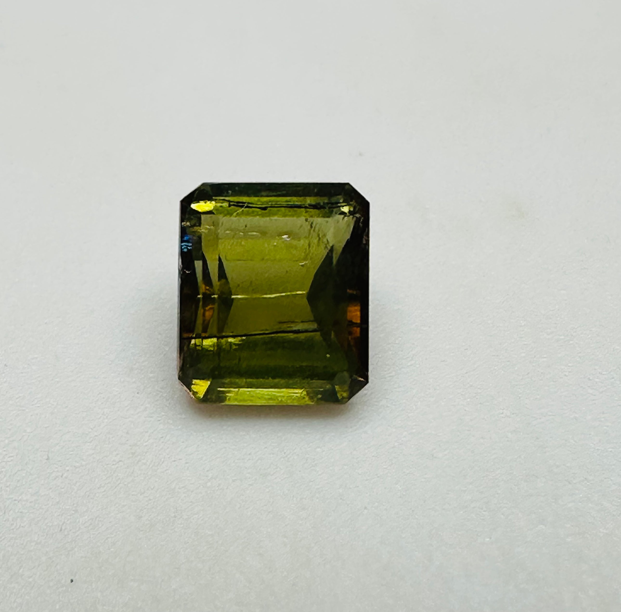 ANDALUSITE  TRAP CUT 7MMX5MM.  1.60CTS GREEN TO RED image 0