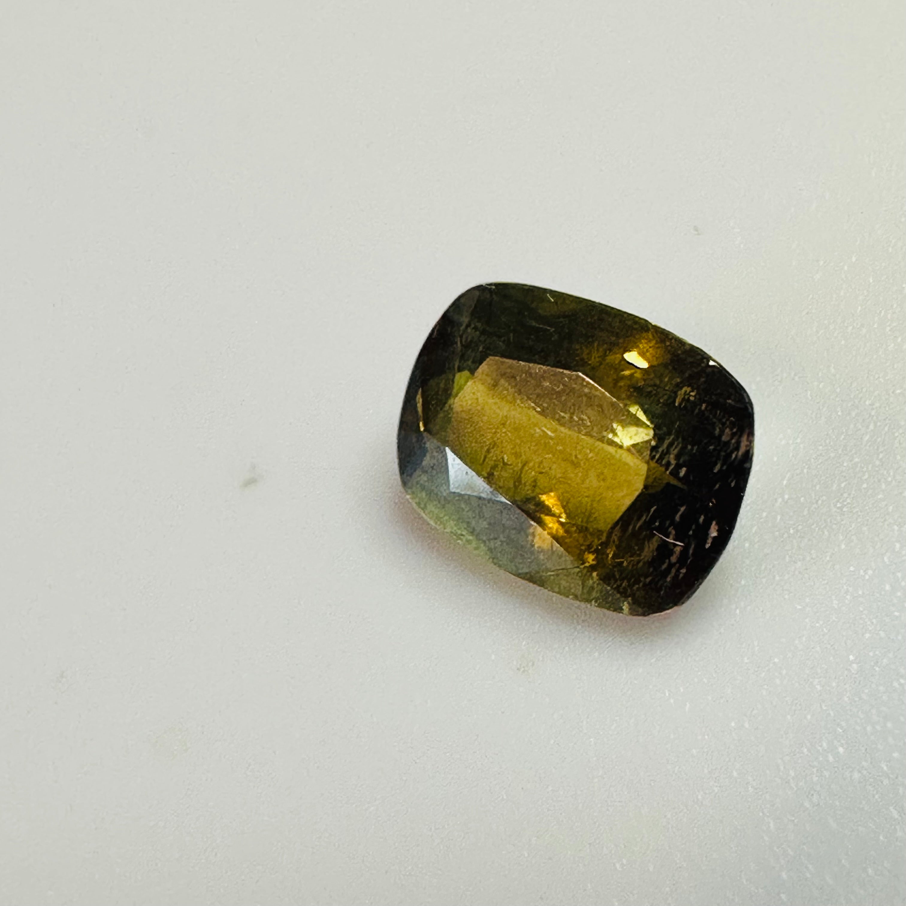 ANDALUSITE  TRAP CUT 8.5MMX6.5MM.  1.47CTS GREEN TO RED image 6