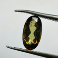 ANDALUSITE OVAL 9.5MMX4MM.  1.25CTS GREEN TO RED image 0