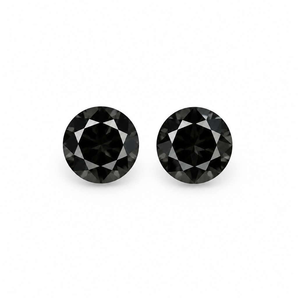 Pair of two matching loose round black diamonds, 2.2mm each, on a clean pure white background