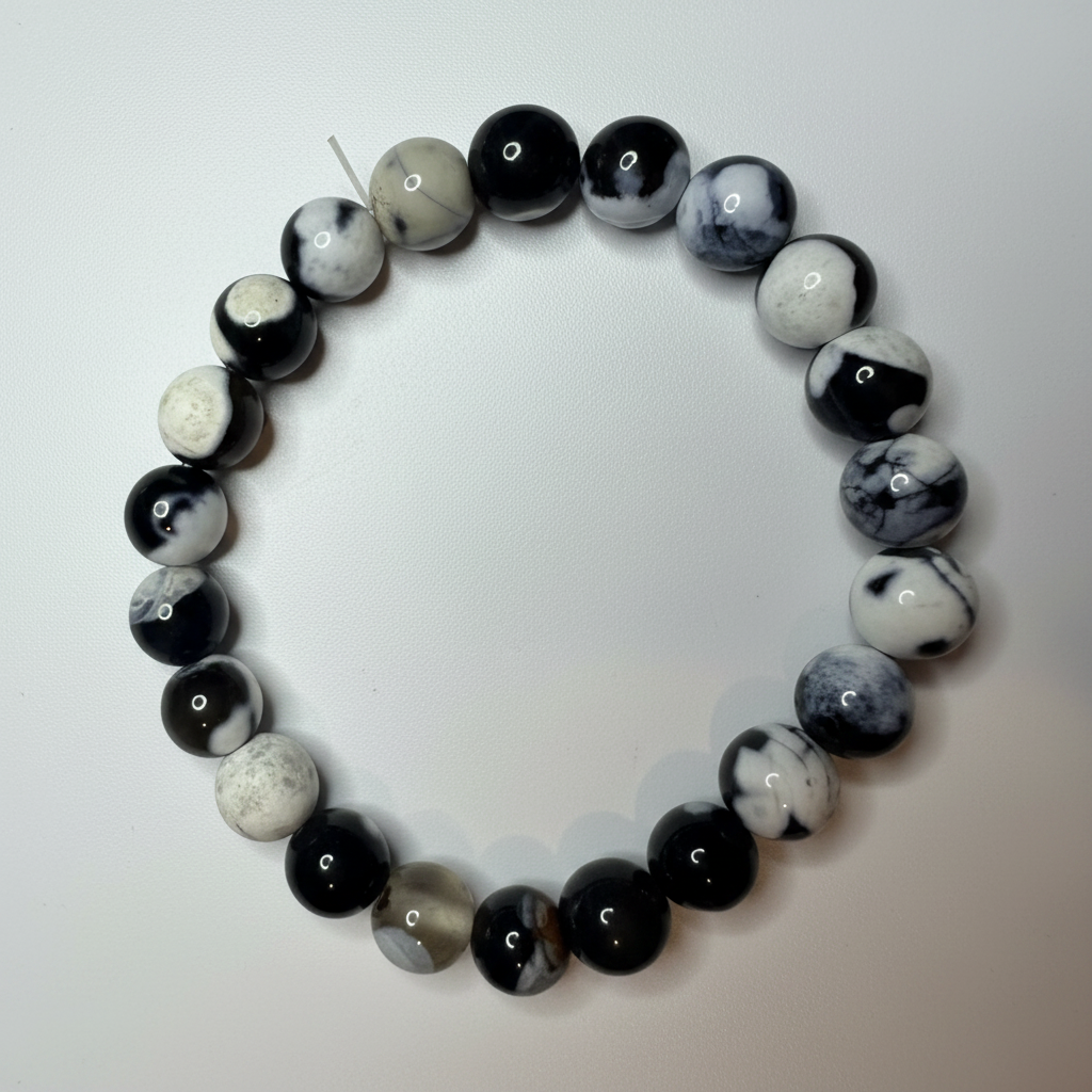Orca Agate beaded bracelet 8mm beads black and white pattern overhead view