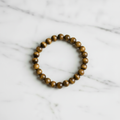 Tiger's Eye beaded bracelet 6.5mm beads on elastic cord, overhead flat lay